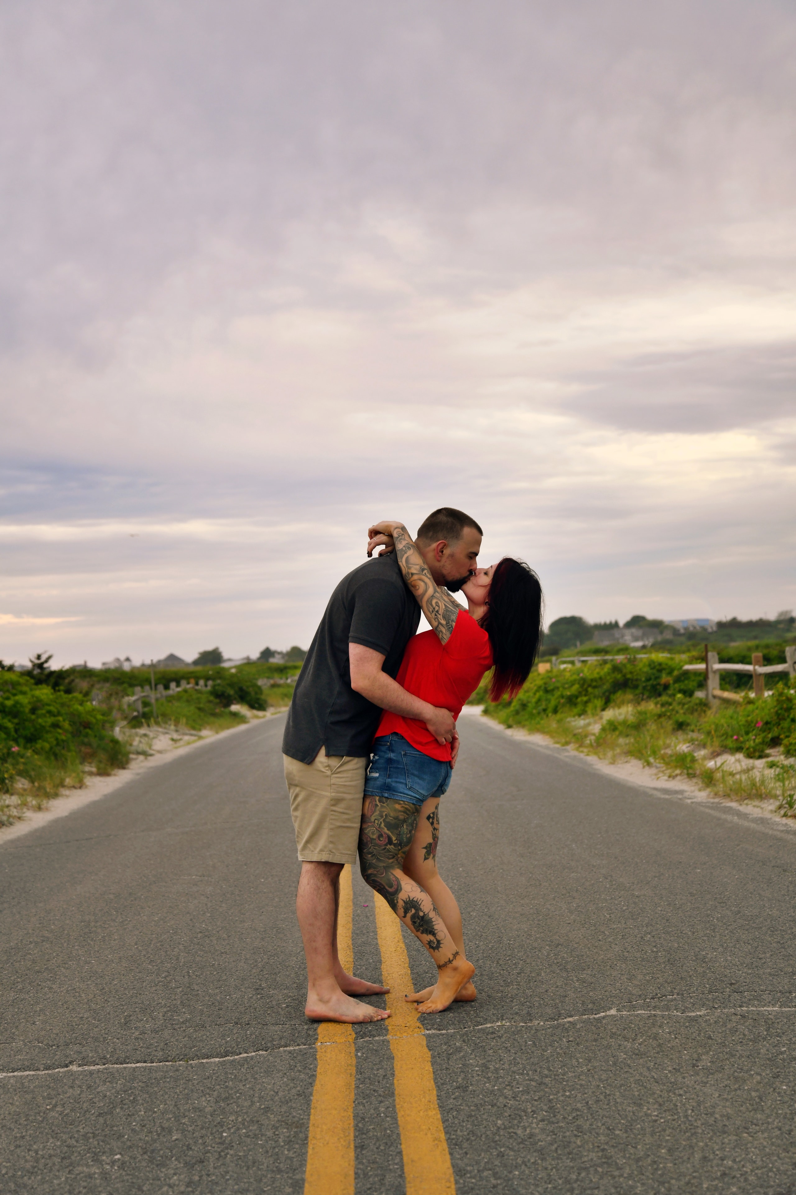 Couple kissing on a coastal road