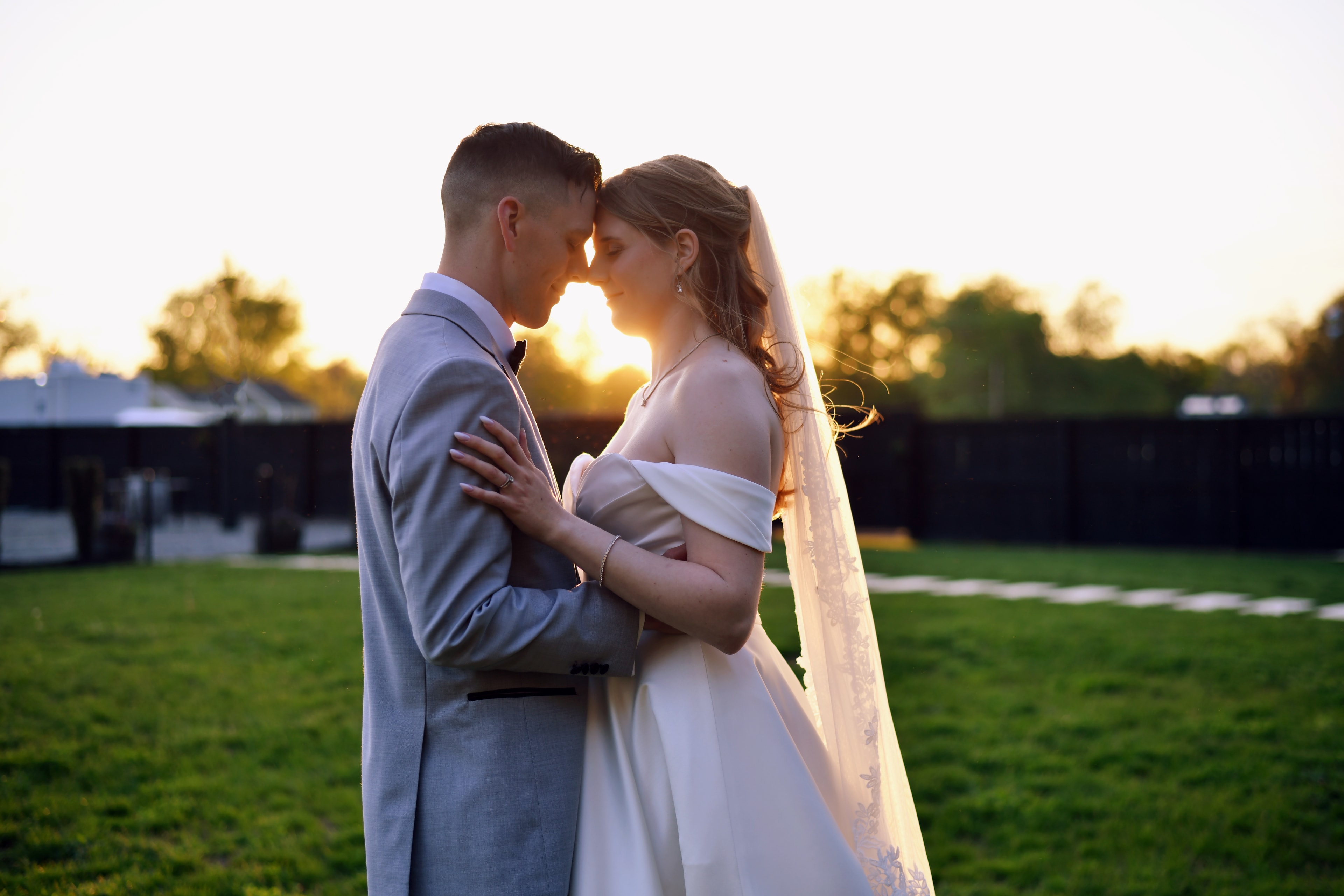 Couple embracing at sunset in a field
