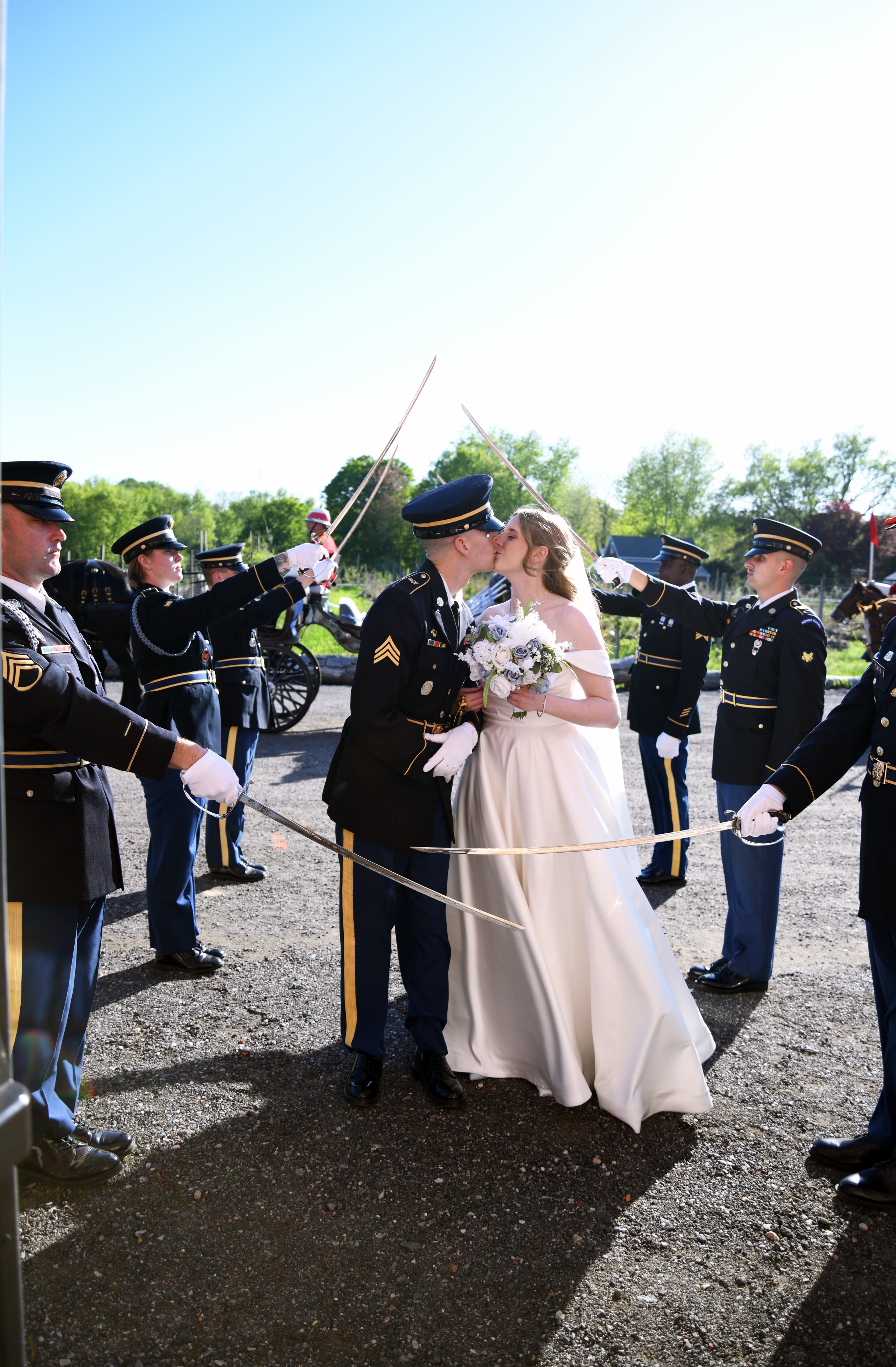 Military wedding saber arch ceremony kiss