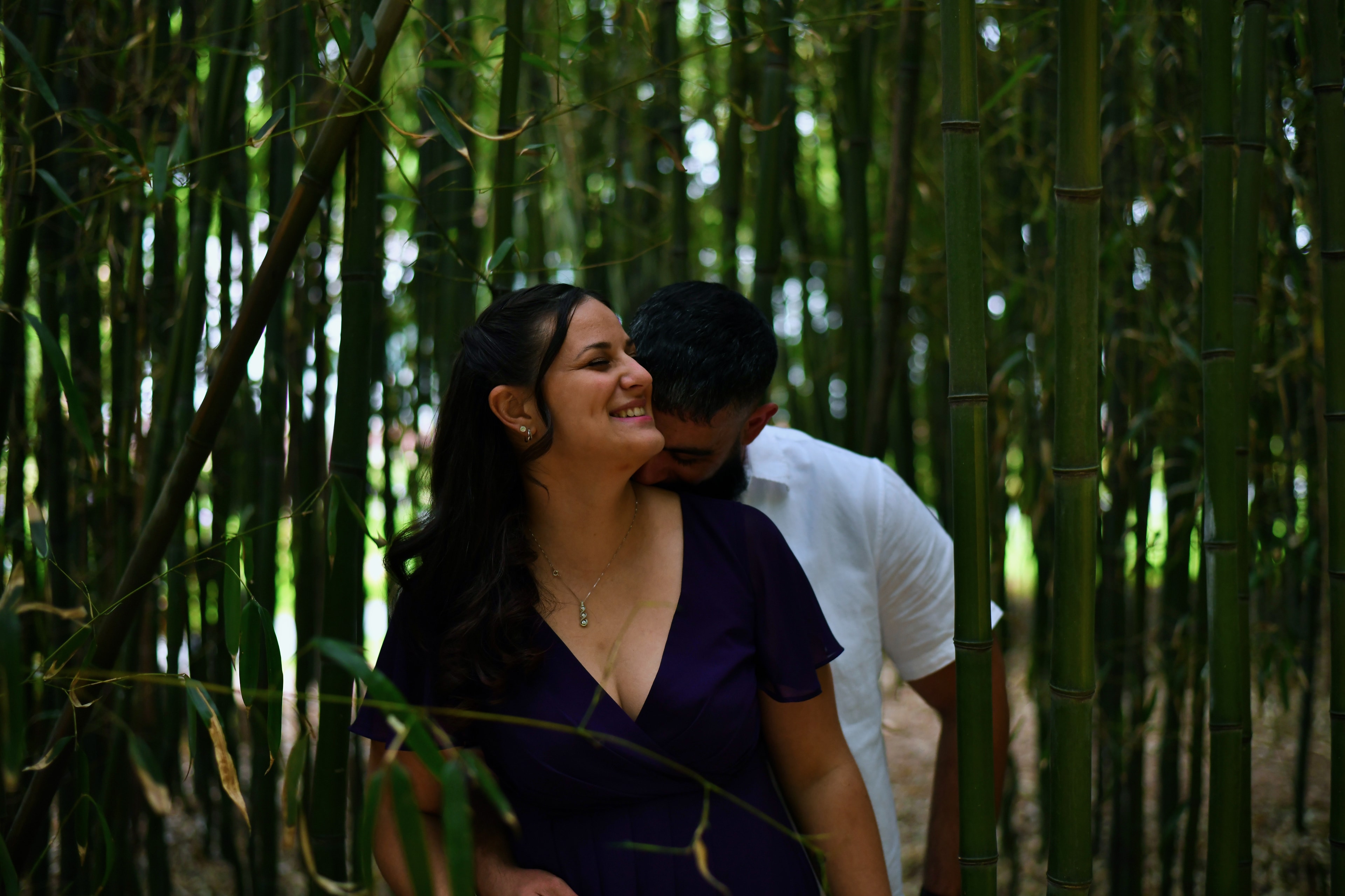 Couple laughing together in a bamboo forest